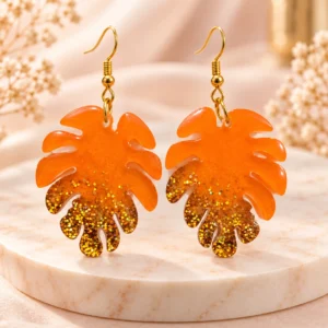 Handmade Orange Monstera Leaf Resin Earrings for Women – Gold Glitter Drop Earrings