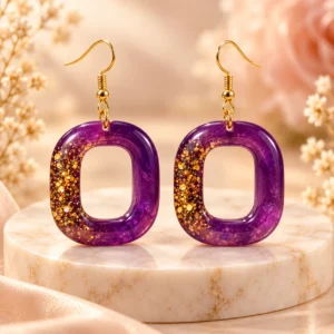 Handmade purple and gold glitter resin drop earrings for women